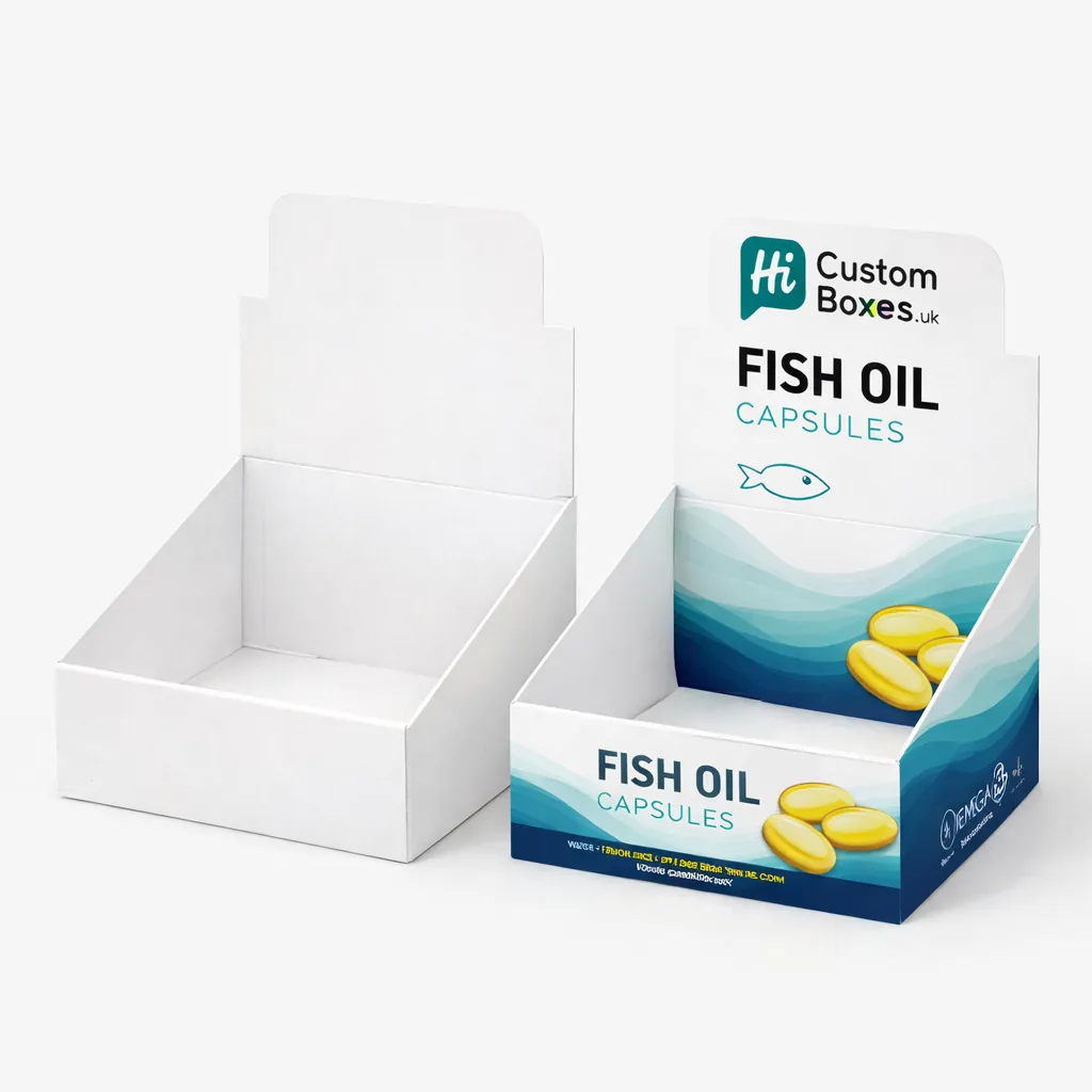 Two cardboard counter display boxes, one plain white and one printed with blue supplement product branding. class=